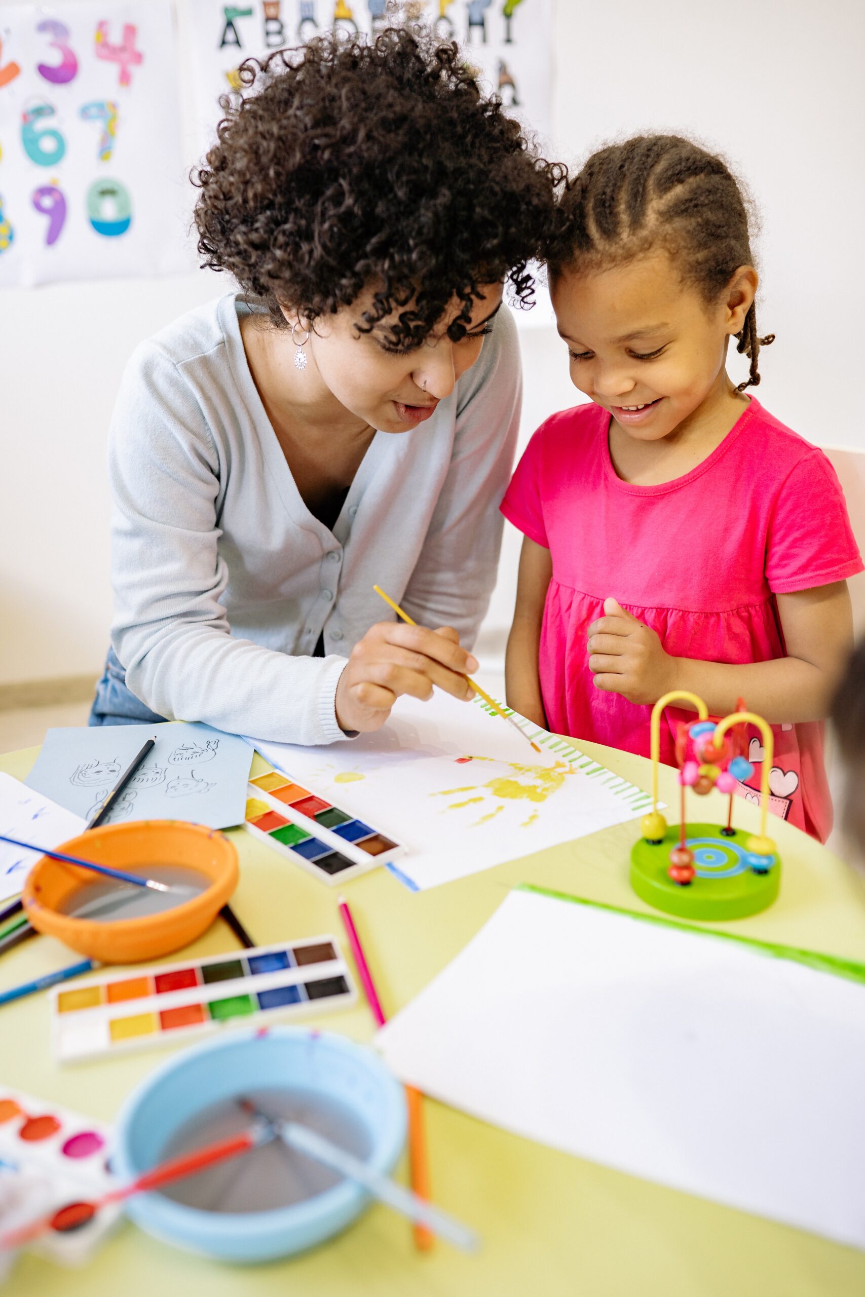 Woman teaching a kid